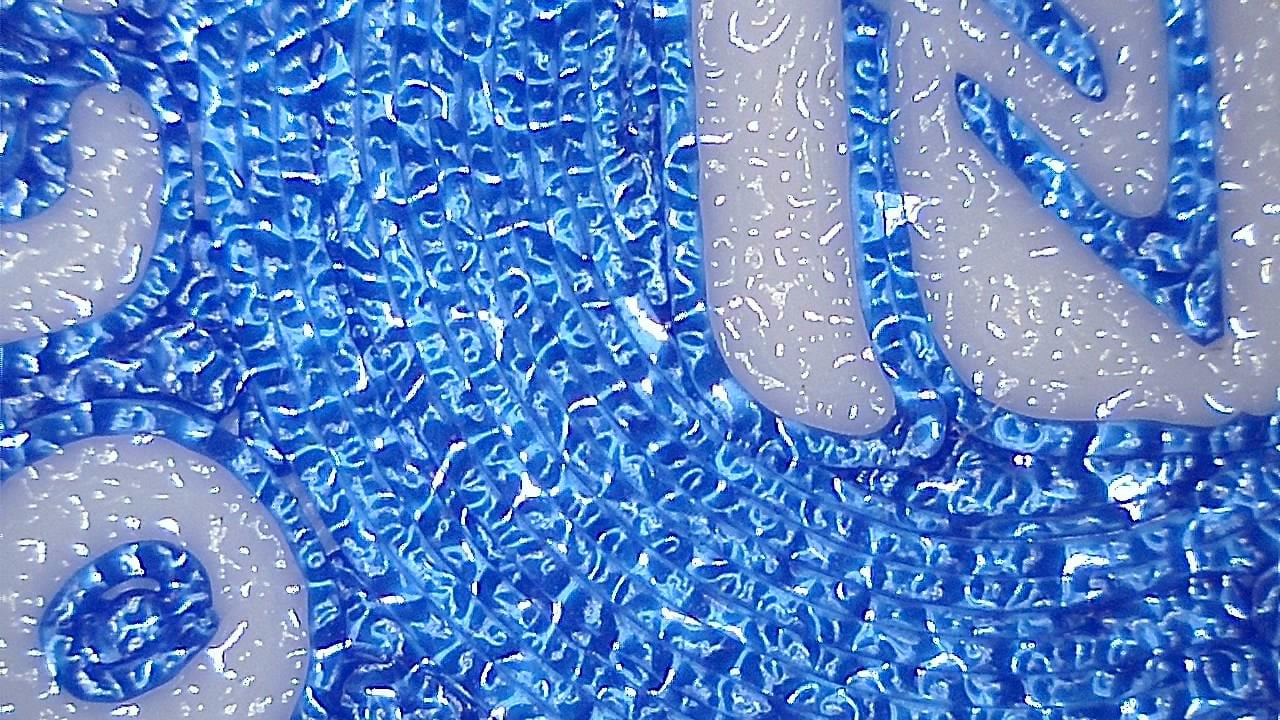 Sample microscope image showing 3D print layer detail and texture